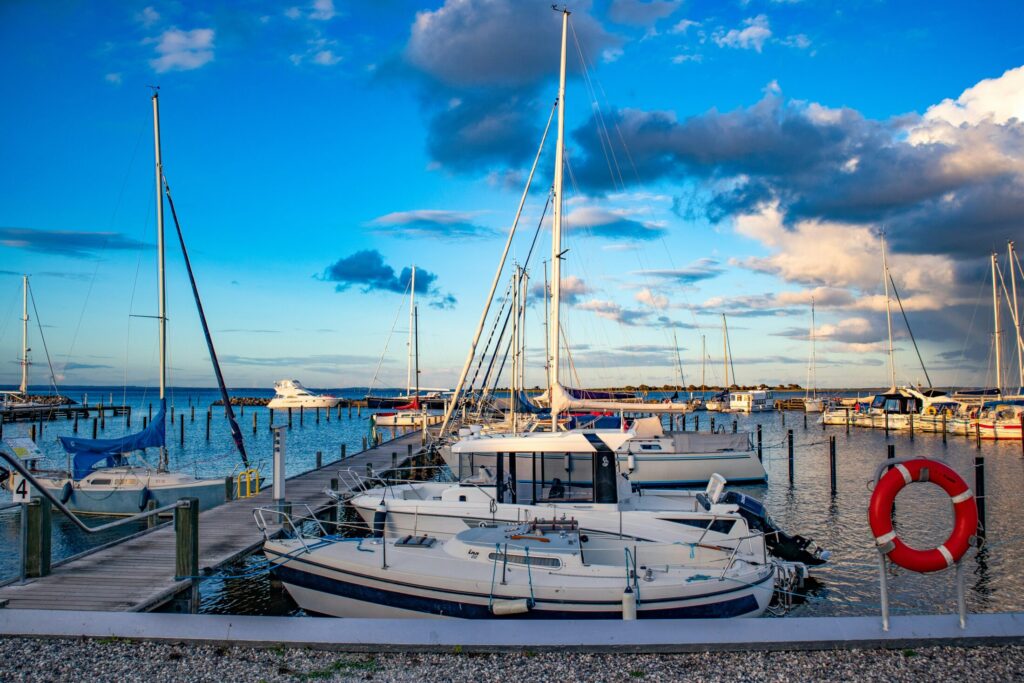 white boats on dock during daytime